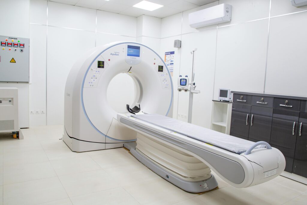 High-resolution image of a modern, clean MRI scanner room in a hospital facility.